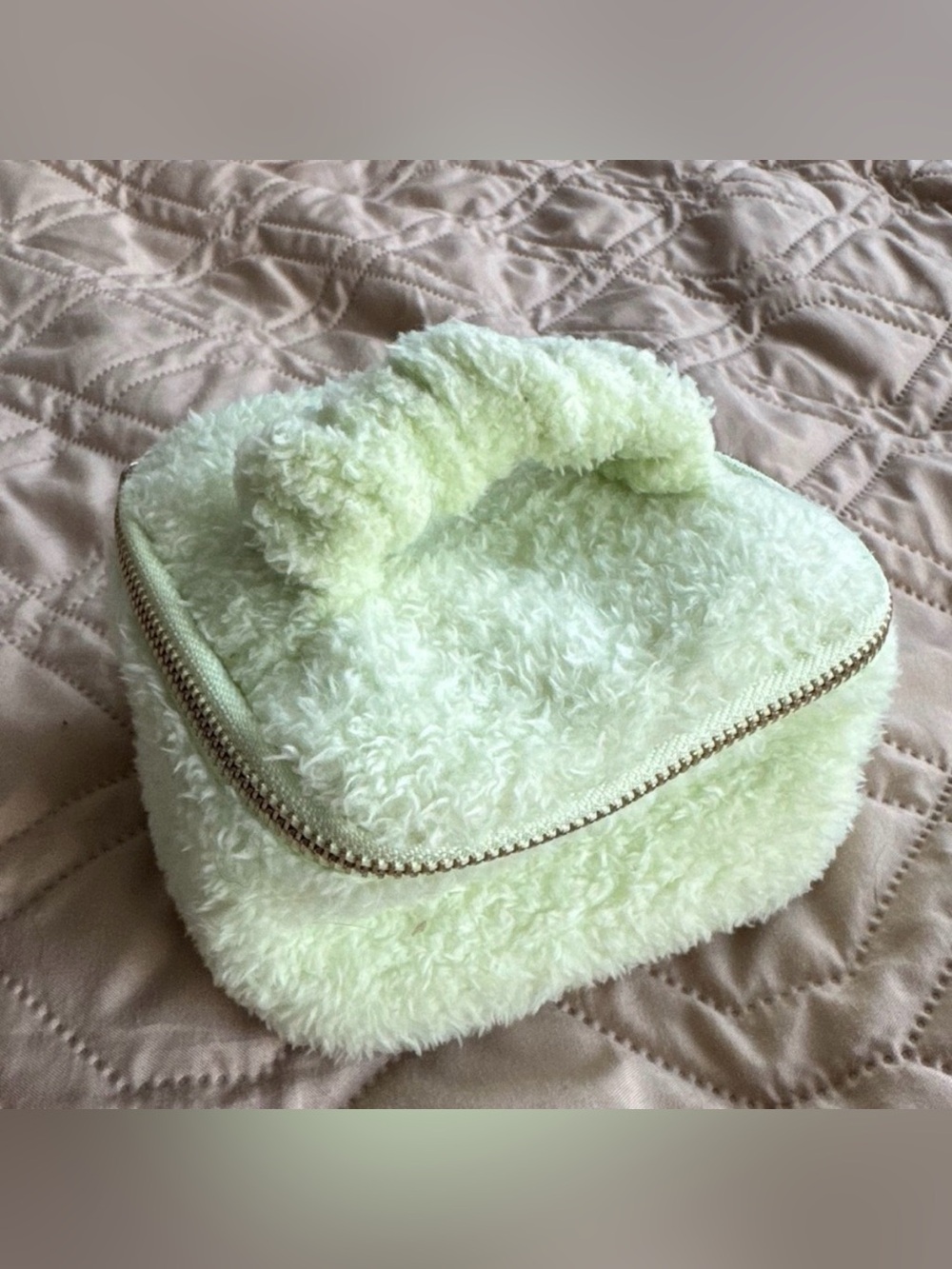 Pastel green fuzzy mini travel jewelry organizer with handle